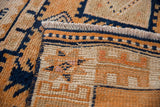 Distressed Kurd runner pile, intact selvage, geometric tangerine and navy patterns.