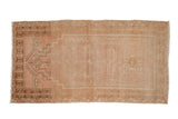 Distressed vintage Oushak rug with a stepped mehrab prayer design in dusty rose and coffee brown tones.