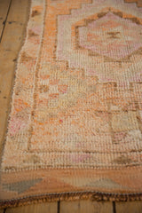 Distressed short pile, side selvage, and geometric patterns of Kurd runner.