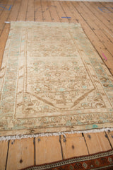Worn Herati motif on distressed vintage Hamadan rug, revealing faint foundation and beige tones.