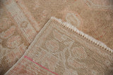 Close-up of the hand-knotted foundation and secured selvage on the reverse of a vintage Oushak rug.