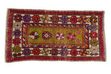 Vintage Oushak rug with unusual moss green field, floral top view, abrashes, and vibrant borders.
