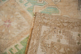 Original side selvage on a Vintage Distressed Kars carpet, showing its geometric reverse and worn pile.