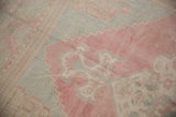 Evenly worn knot heads showing the distressed texture of a vintage Oushak carpet.