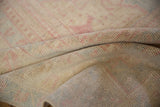 Textural detail of the hand-knotted reverse side of a vintage distressed Oushak rug.