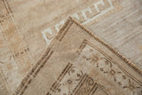 Hand-knotted foundation and original corded selvage of the distressed Oushak carpet.