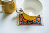 Burham style Navajo Coaster with intricate pictorial design, fringe, and 