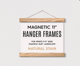 11 inch Magnetic Wooden Hanger Frame with aged oak finish, holding a white poster.