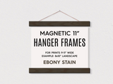 Ebony finish 11 inch magnetic wood hanger frame with reddish-brown hanging cord.