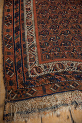Antique Afshar rug's madder red, navy, ivory geometric border, and visibly worn kilim.
