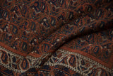 Geometric boteh pattern and border detail of an Antique Afshar rug in madder red, navy, ivory.