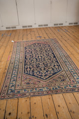 Blush pink and dusty sky blue borders on a vintage Hamadan rug corner, intact selvage.