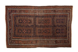 Vintage Belouch rug with multi-panel designs and pawn motif borders in navy blue, terracotta, and brown.