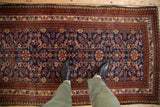 Fine hand-knotted Malayer rug with allover floral field in indigo, ruby red, and blush.