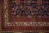 Vintage Malayer rug corner with deep blue field, red, beige multi-banded borders, and edge wear.