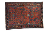 Vintage hand-knotted Lilihan rug, brick red field with blue and green tree of life motifs.