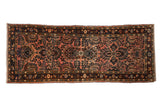 Distressed Lilihan rug runner with dusty raspberry floral sprays, navy borders, 2'8
