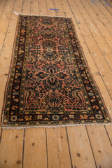 Vintage distressed Lilihan runner detail, showing dusty raspberry, navy floral pattern and pile.