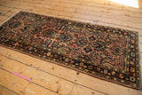 Distressed Lilihan runner pile texture with dusty raspberry field and navy floral design.