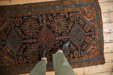 Triple medallions and Herati motif with even wear on a vintage Mehriban rug.