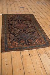 Vintage Mehriban rug detail: geometric Herati field in navy, madder red, and cantaloupe.
