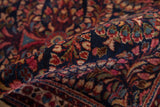 Textured pile of vintage American Sarouk rug, with rare dark blue ground and floral patterns.