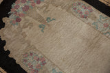 Angled view of the vintage Fette-Li rug's textured pile and floral basket detail.