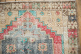 Vintage Distressed Oushak rug worn pile, stepped patterns in dusty blue, pale red, and sand.