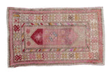 Vintage distressed Oushak rug, pink and ivory floral design, playful colorful interior borders, 2'6