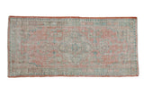 Distressed hand-knotted Turkish Oushak runner, faded coral, sand, and soft green floral medallion.