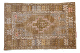 Distressed vintage Oushak rug with stepped medallion, geometric border, olive green and silver hues.