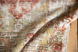 Decorative distressed Oushak rug, showing worn texture in red, orange, yellow, and ivory.
