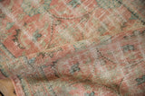 Distressed vintage Oushak runner pile with blush, mint, and ivory Herati motif.
