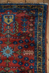Lilihan rug corner: deep cherry red, sapphire blue border, scarce yellow stripe, fringe.