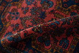 Fine, hand-knotted pile of a vintage Mehreban rug with raspberry and sapphire blue floral bouquets.
