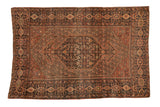Antique Farahan Sarouk rug with hexagonal Herati medallion, allover boteh field, and time-softened hues.