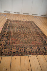 Antique Farahan Sarouk rug detail: Herati medallion, boteh field, floral border, and muted tones.
