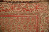 Distressed Malayer rug field, revealing germinating botehs with worn cinnabar red and ivory tones.