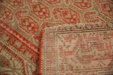 Malayer rug with hand knotted woven foundation, intact side selvage, and distressed red pile.