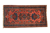 Vintage Mehriban runner with dusty pink field, deep teal palmettes, and vine border.