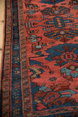 Vintage Mehriban rug detail: dusty pink field, teal border, palmette motifs.