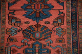 Vintage Mehriban runner detail: dusty pink field, deep teal palmettes, and vine border.