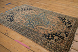 Worn fringe, dark floral border, and visible faint foundation on an antique Farahan Sarouk rug.