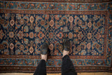 Vintage Mehriban rug detail showing allover Herati design in sapphire blue and coffee brown tones.
