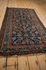 Vintage Mehriban rug border details and sapphire blue Herati pattern with serrated leaves.