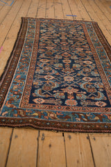 Vintage Mehriban rug showing cobalt Herati motif, serrated leaves, and blush border.