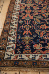 Antique Kurdish Bijar rug: Ivory geometric border, cobalt blue field with floral palmettes.