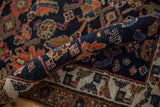 Antique Kurdish Bijar rug’s rolled edge, with cobalt blue field, madder red patterns, and secure selvage.