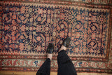 Vintage Hamadan rug field, Herati pattern in navy, ruby red, ivory, and subtle abrashes.