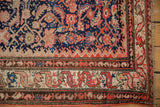 Vintage Hamadan rug corner with ruby red Herati motifs and intricate ivory, navy, coffee brown borders.